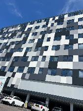 Midway through instalation of window film for solar control heat reflective